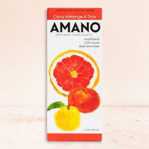 Amano Artisan Chocolate bar with citrus illustrations on packaging. The label reads "Citrus Mélange À Trois." Clean, fresh, and artistic design.