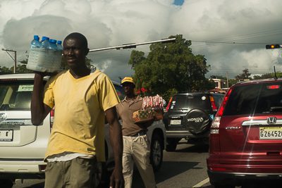 At stop lights in the Dominican Republic, it is not uncommon to be able to buy just about anything from food to electronics from the street vendors.