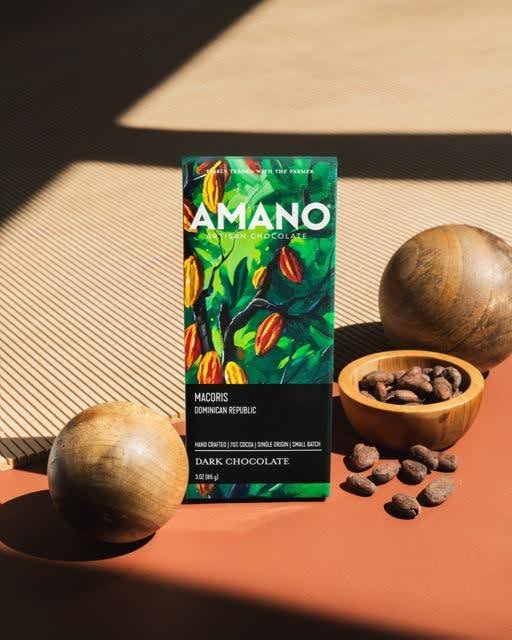 A beautifully wrapped Amano dark chocolate bar emphasizing its deep brown color and premium quality