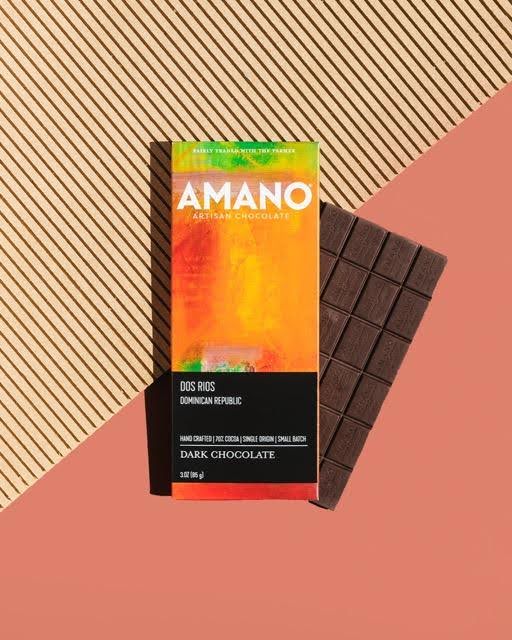A close-up of an Amano dark chocolate bar showcasing its sleek packaging and rich dark surface