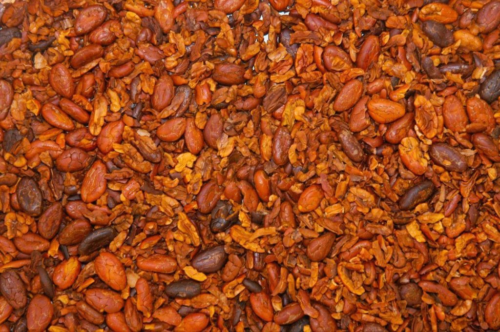 A close-up image of dried red chili peppers emphasizing their deep color and intricate details